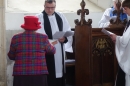 James is presented with the Book of Common Prayer